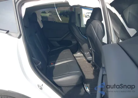 2023 Tesla Model Y Awd/Long Range Dual Motor All-Wheel Drive z USA, uszkodzony, nr VIN 7SAYGDEE4PA045903